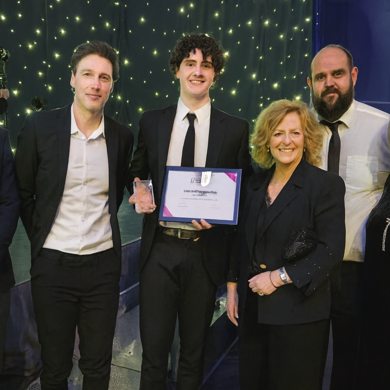 Jack collecting his award alongside