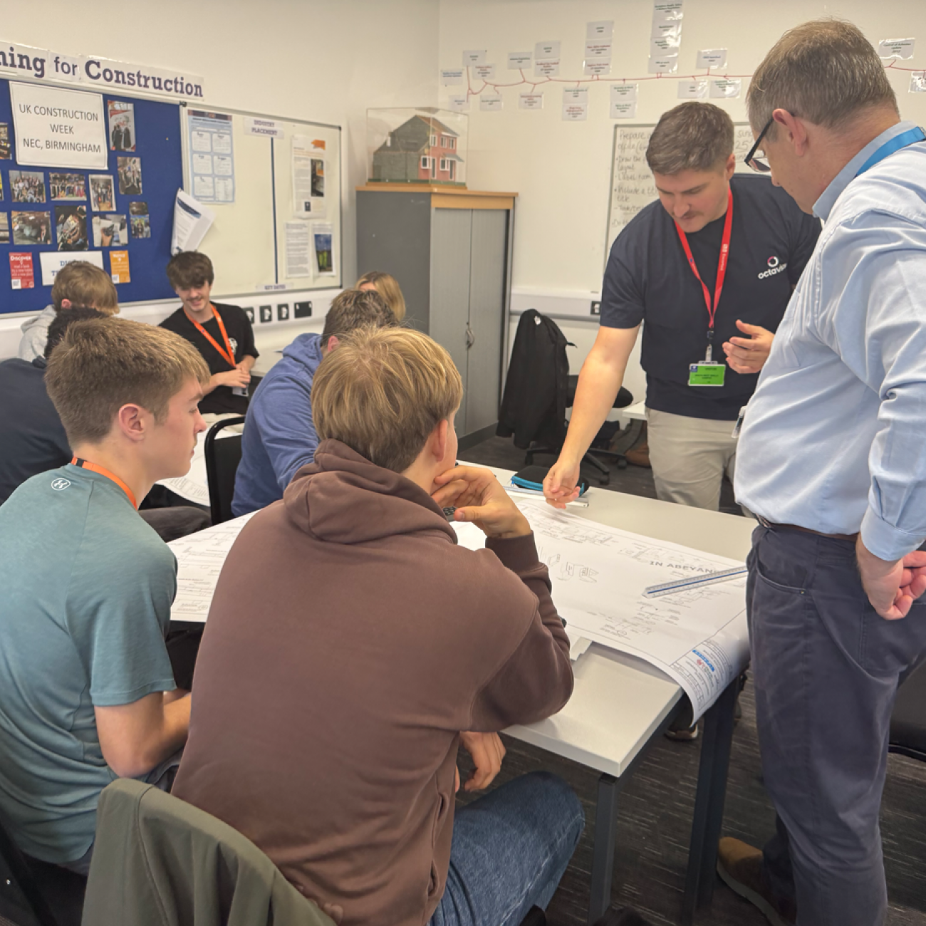 Students talking to Ben about their plans for the bridge