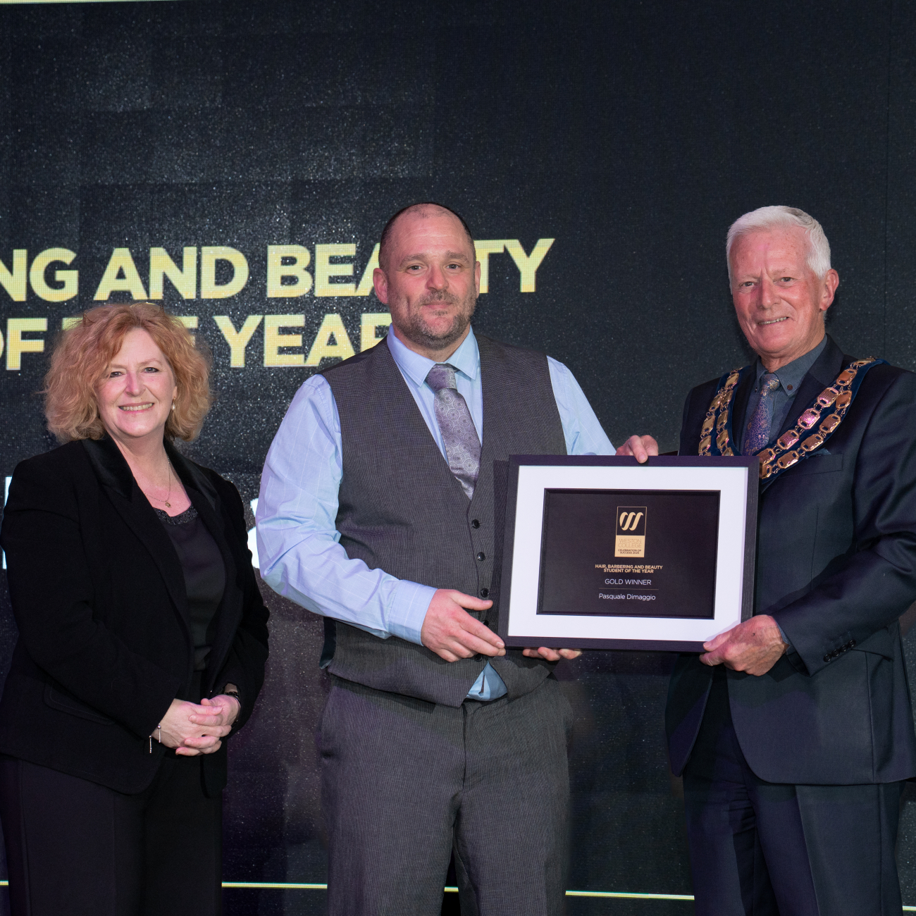 Pasquale winning an award at celebration of success