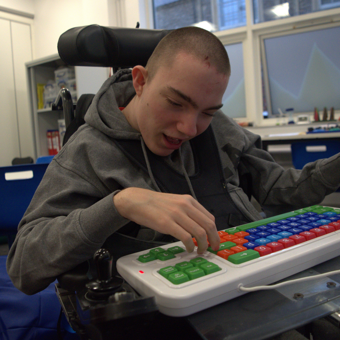 Brandon smiling and looking engaged in class