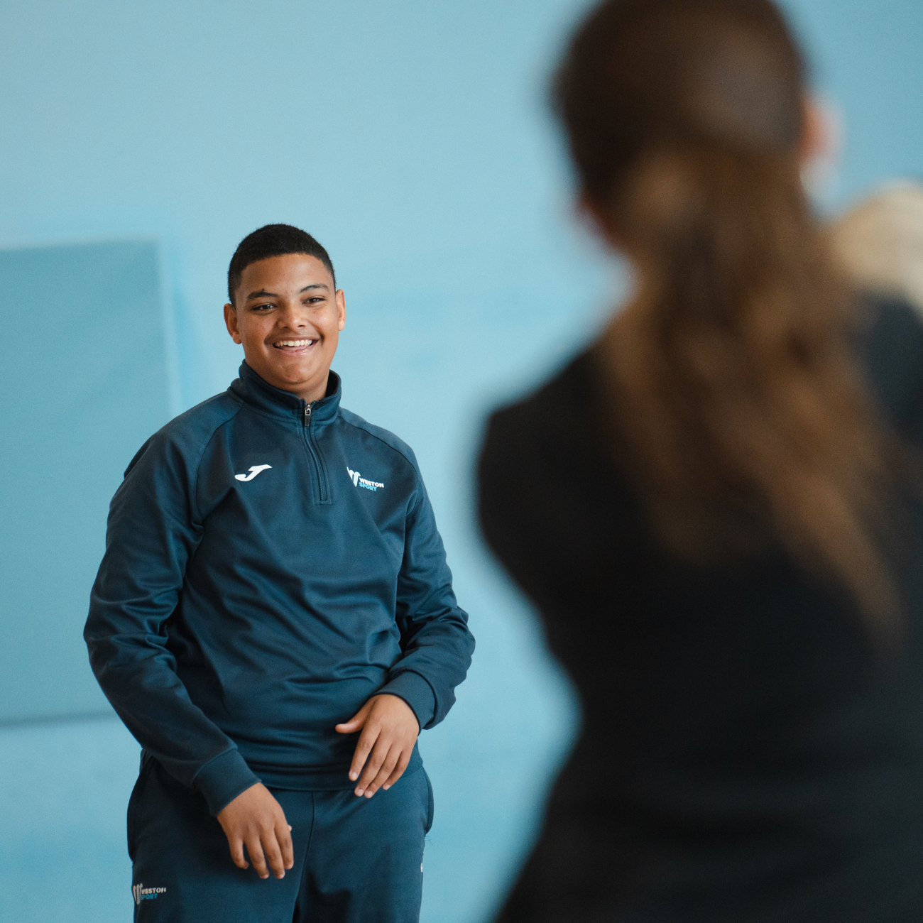 Sport student catching a rugby ball