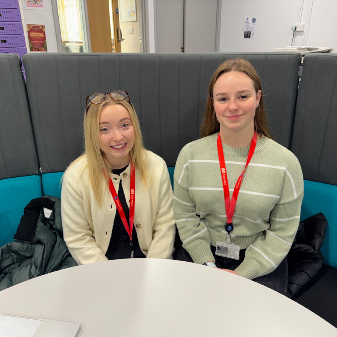 Katie and Alana sat smiling