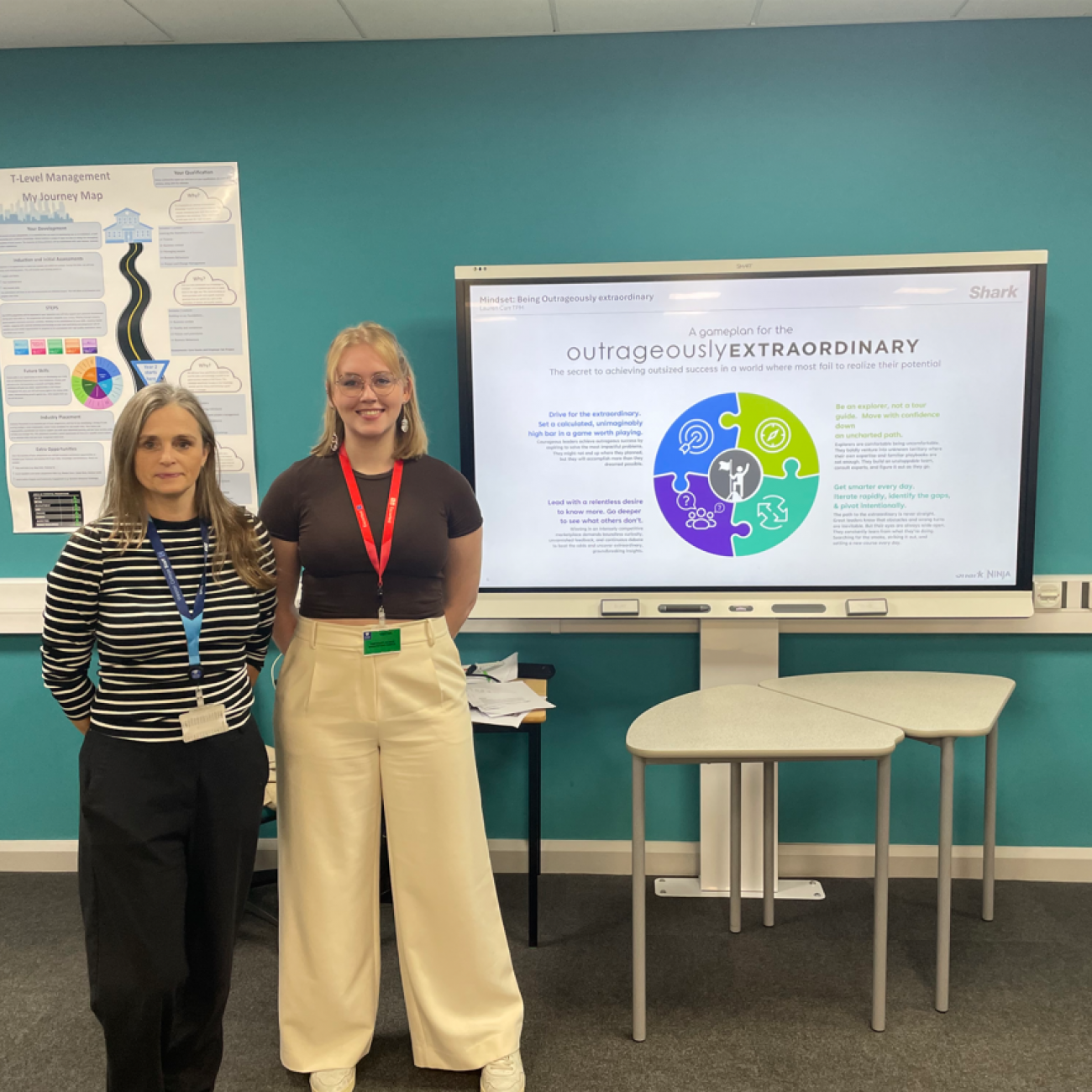 Lauren and Business lecturer, Emma, standing next to the SharkNinja 'outrageously extraordinary' presentation