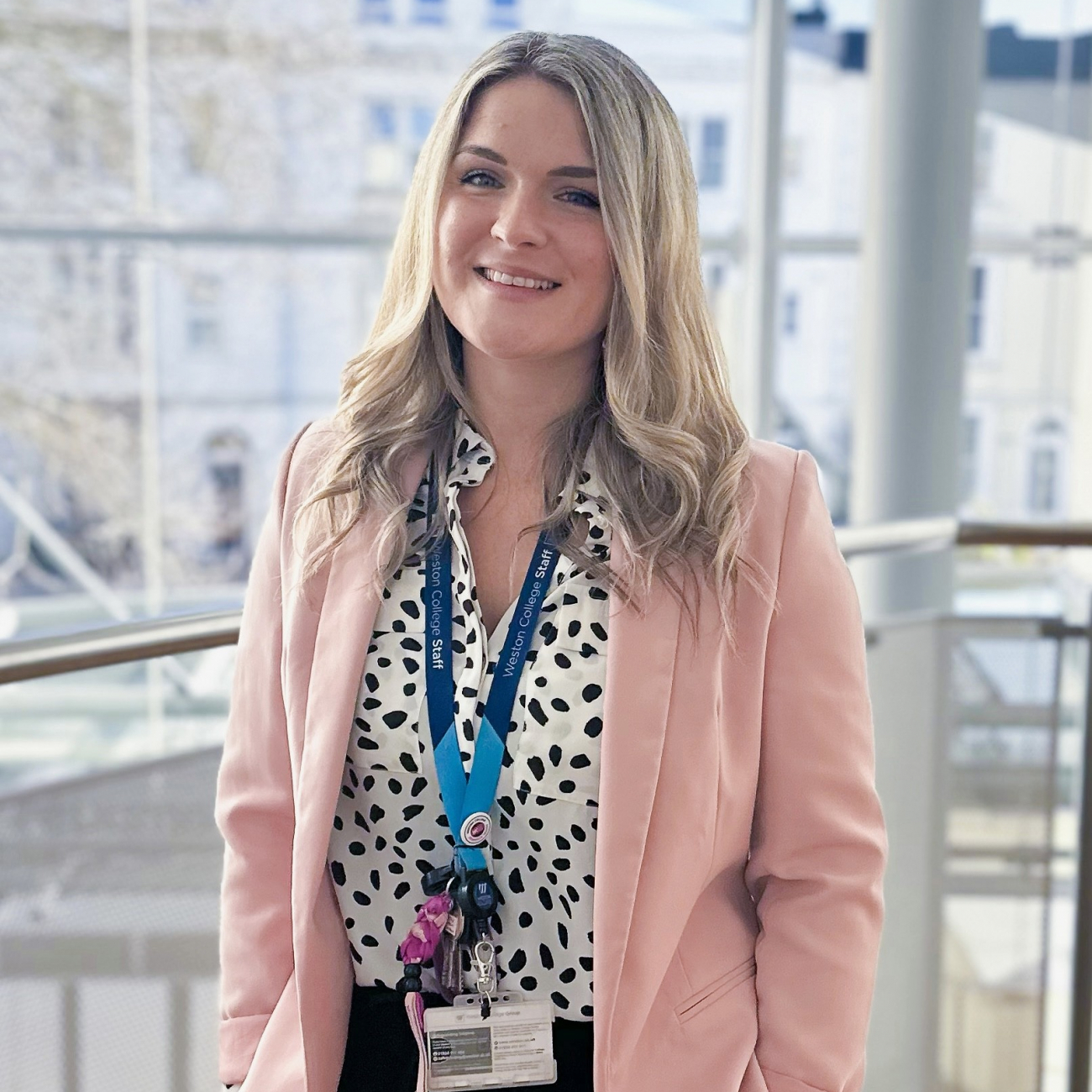 Chloe Wilde standing on balcony smiling