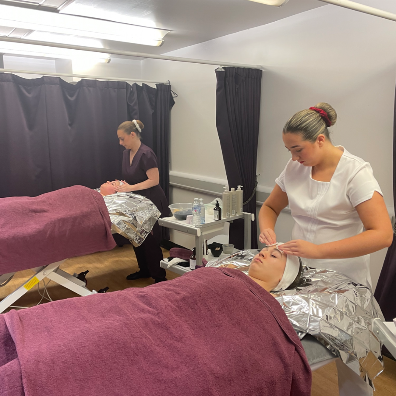 Squad UK practicing a time-pressure challenge on Beauty Therapy students