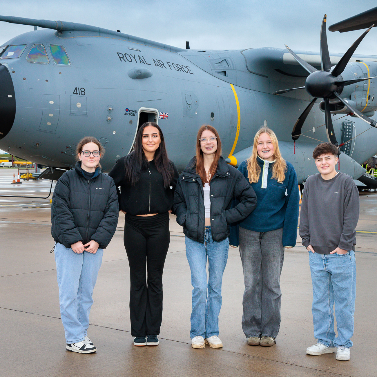 Students standing in front of a RAF plane
