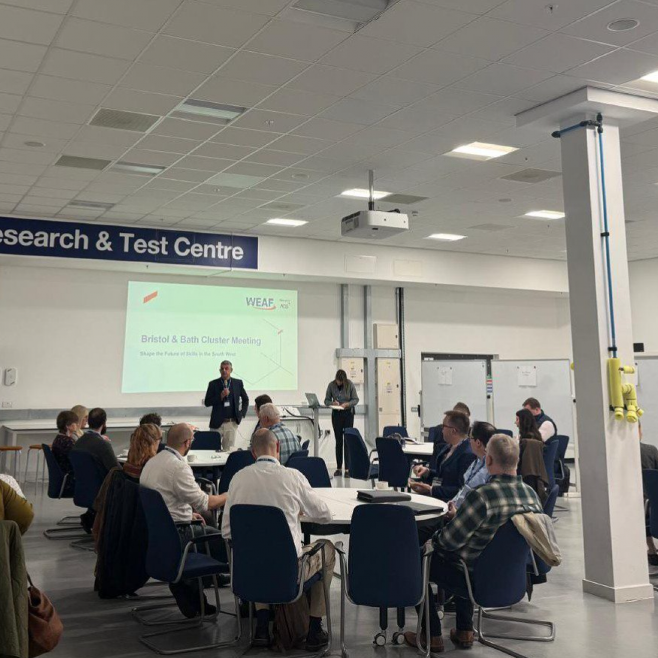 Photo of event attendees sat around tables at WEAF Bristol