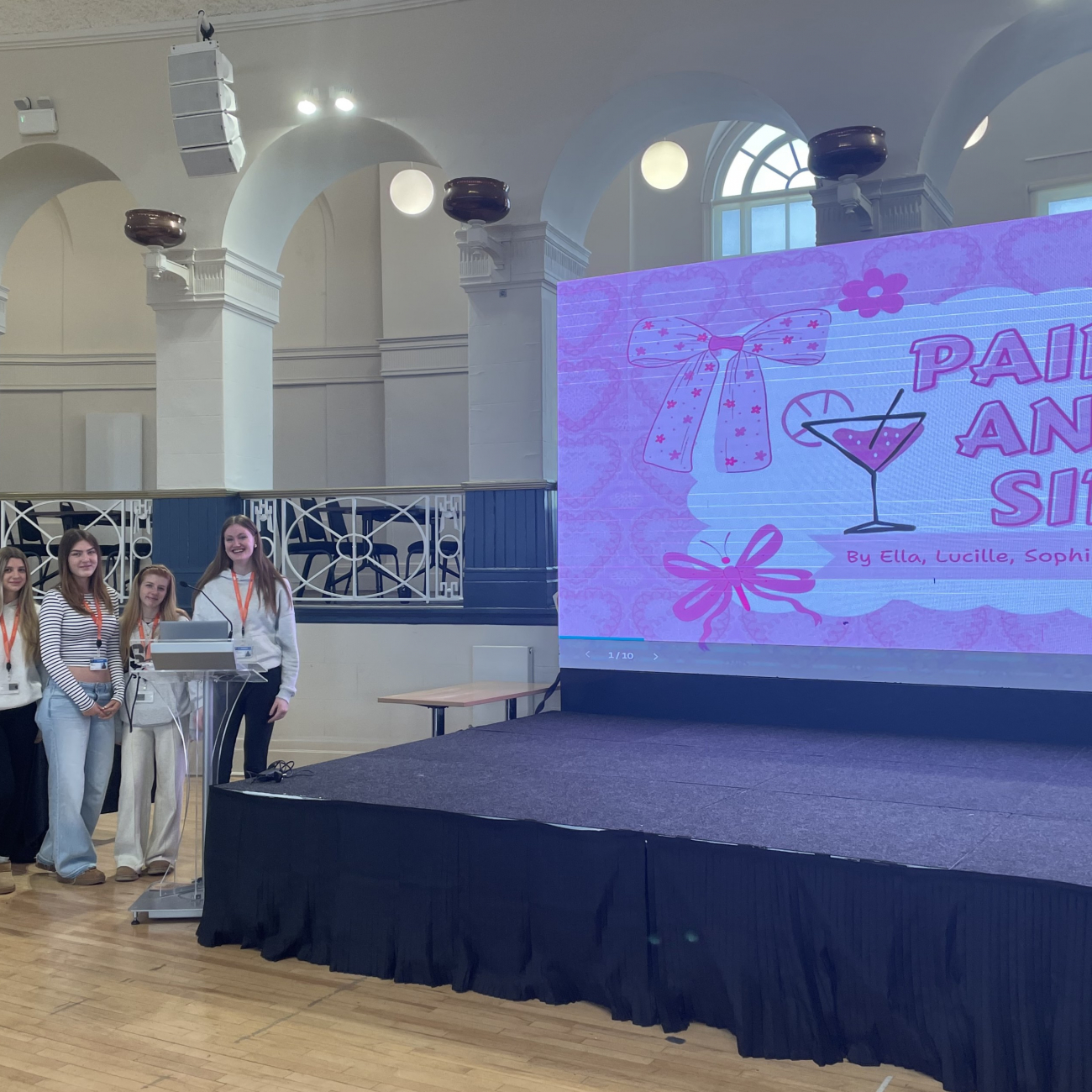 Students standing next to their pitch idea