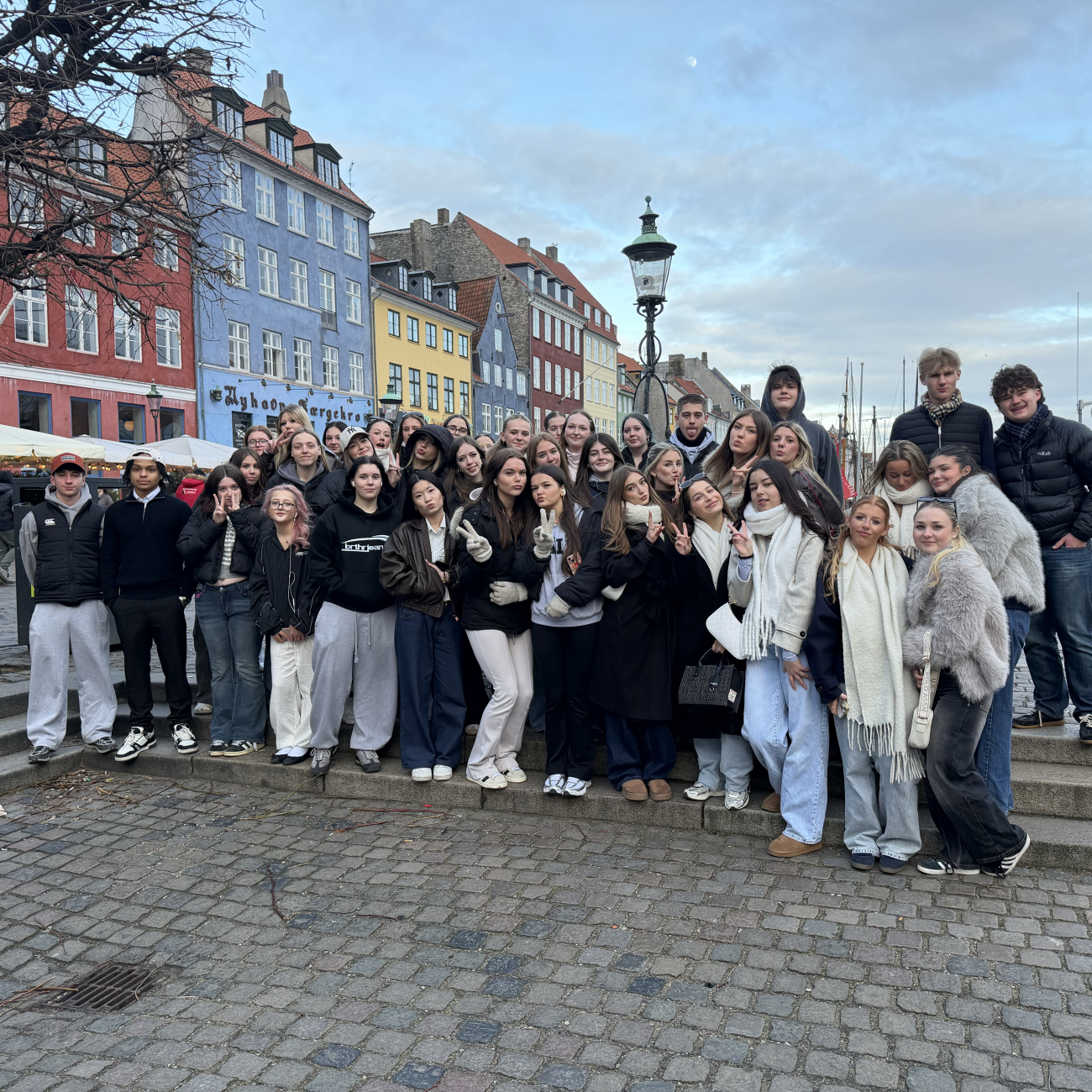 Business and Travel students standing in front of colourful buildings