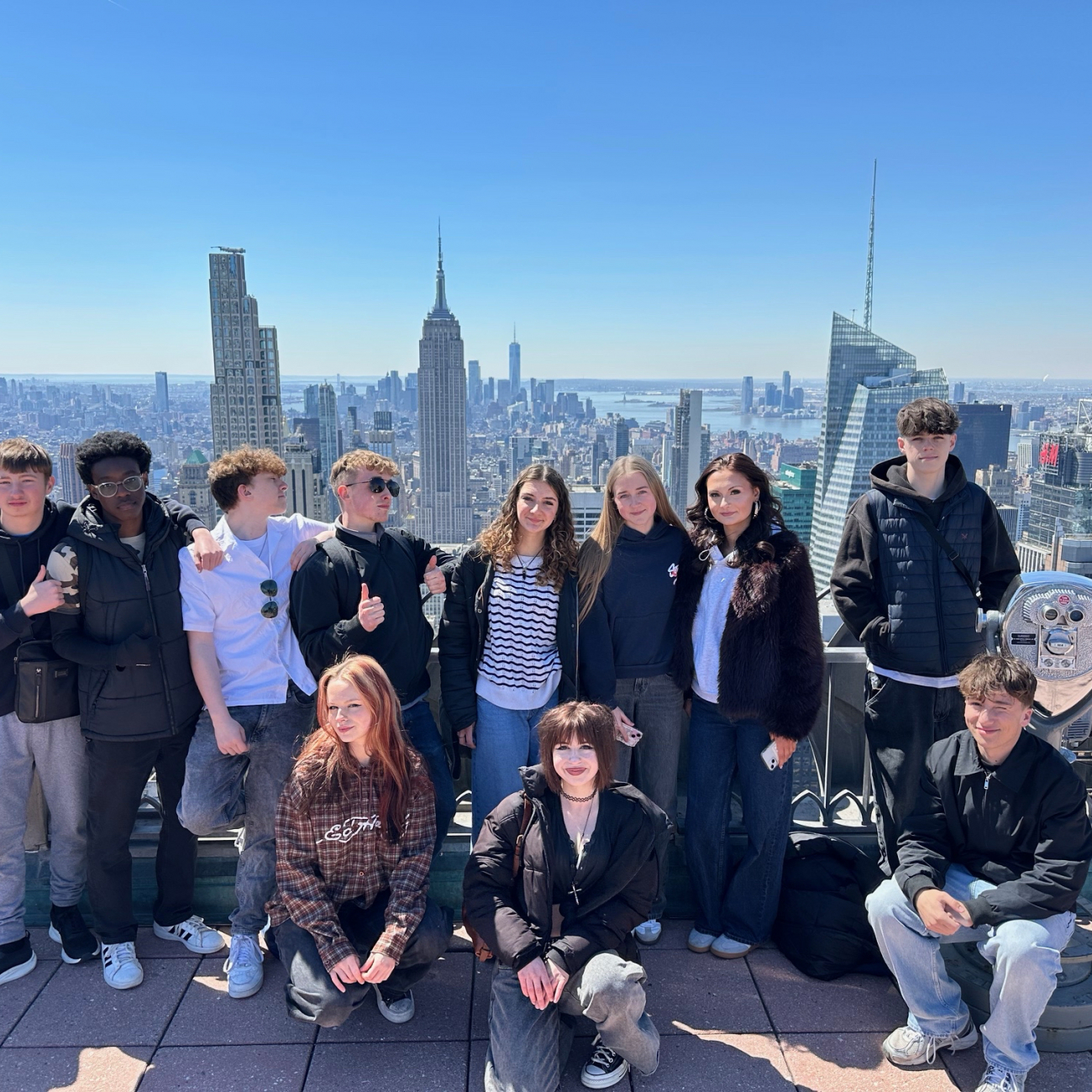 Students standing in front of the skyline