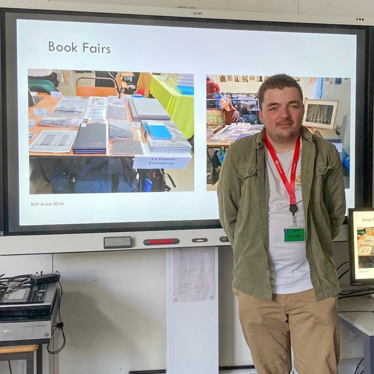 Josh standing in front of his presentation