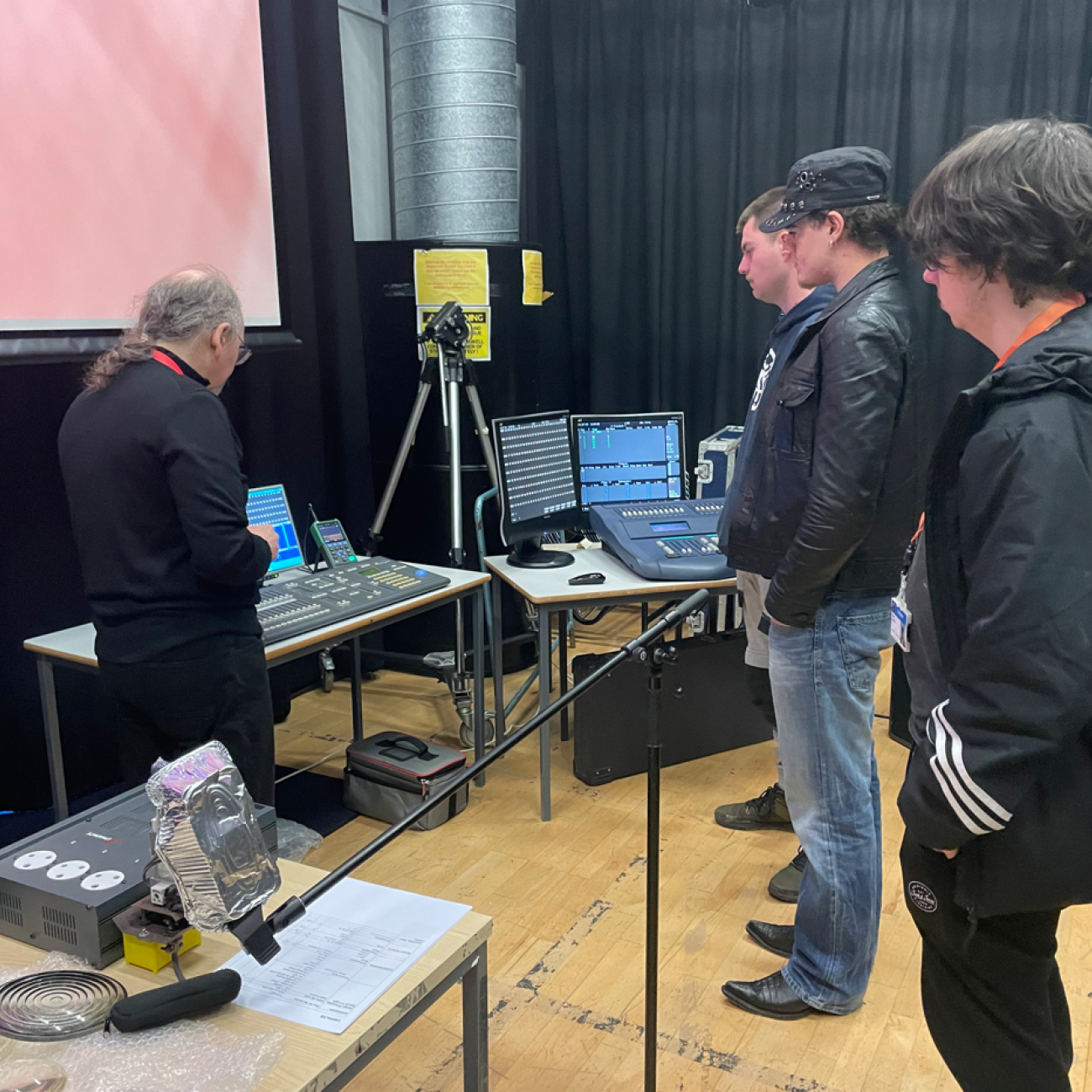 Mike showing students different lighting boards