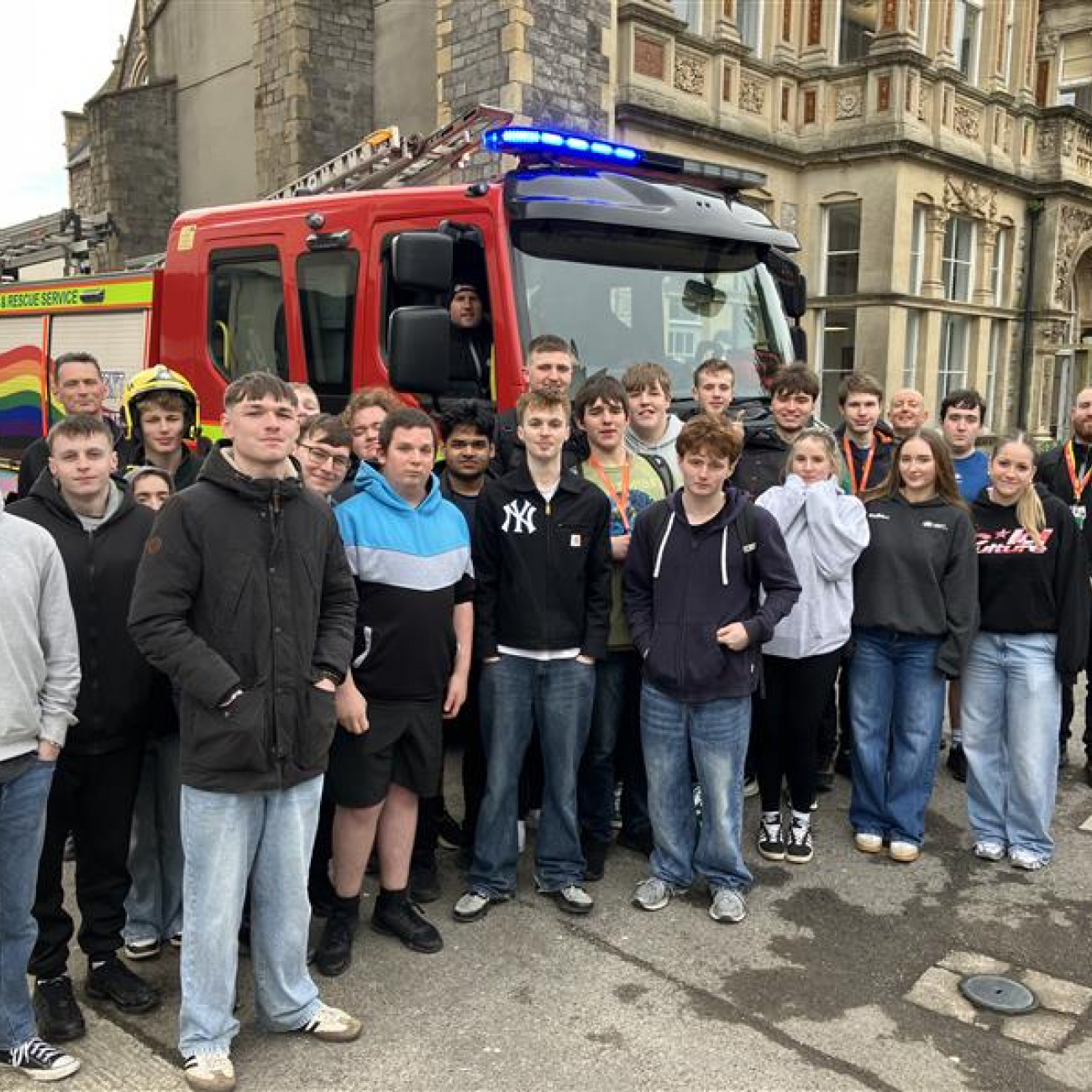 Students standing in front of a fire engine