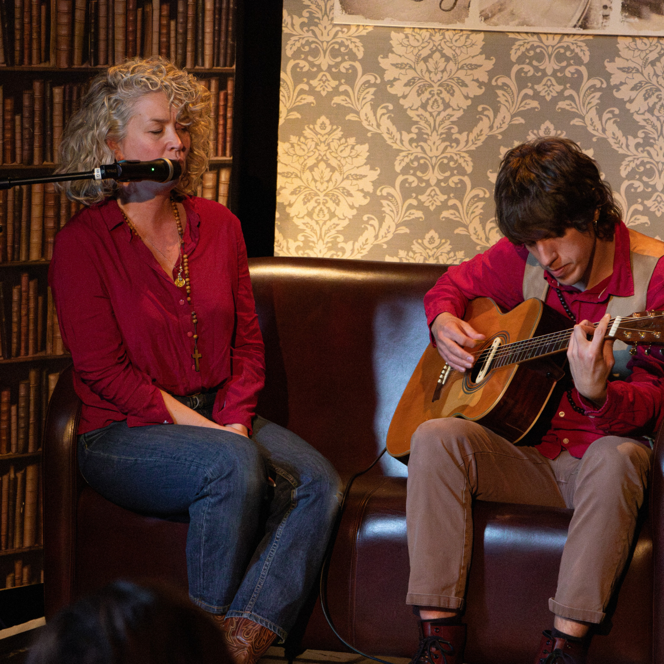 Beth and Tom singing to the group