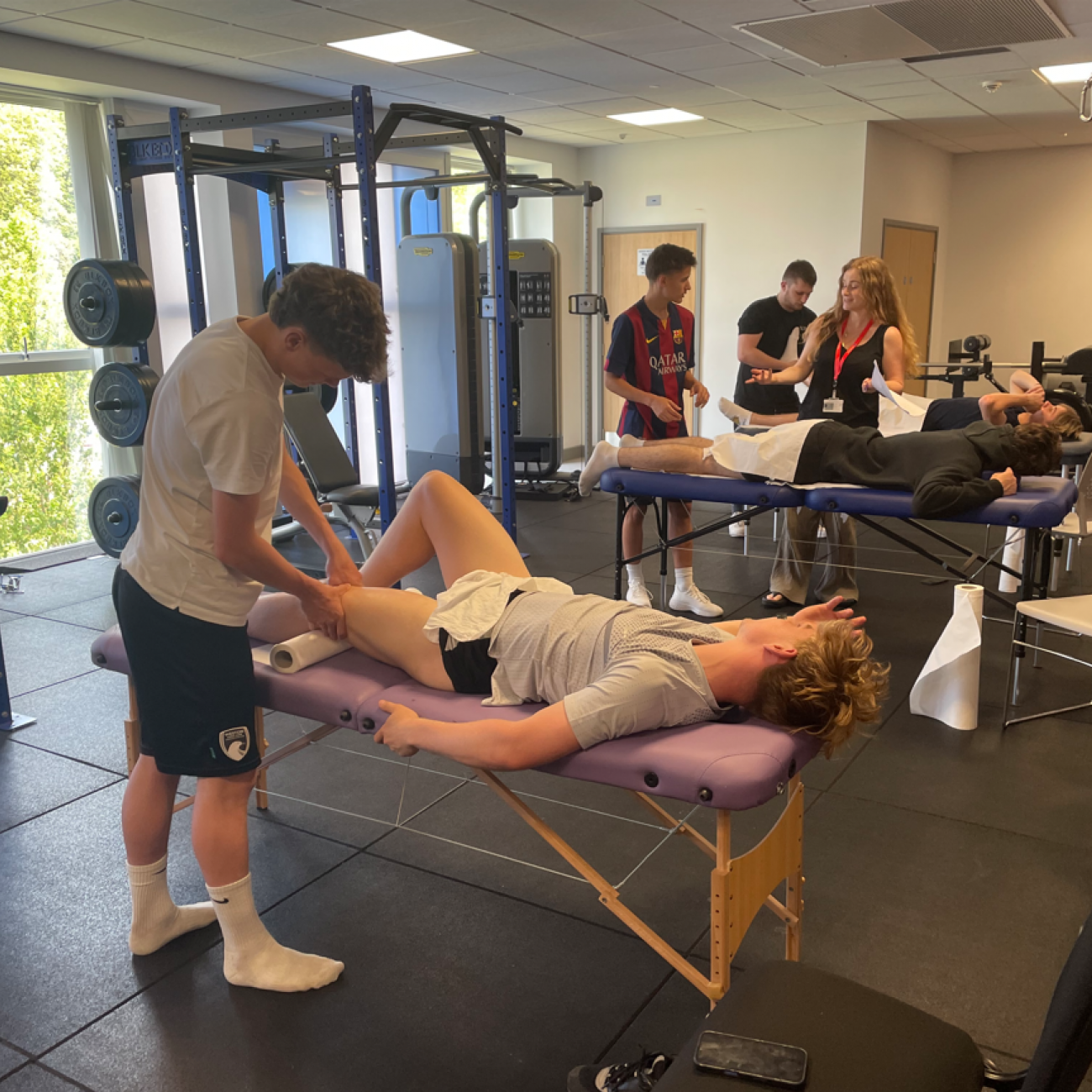students massaging muscles