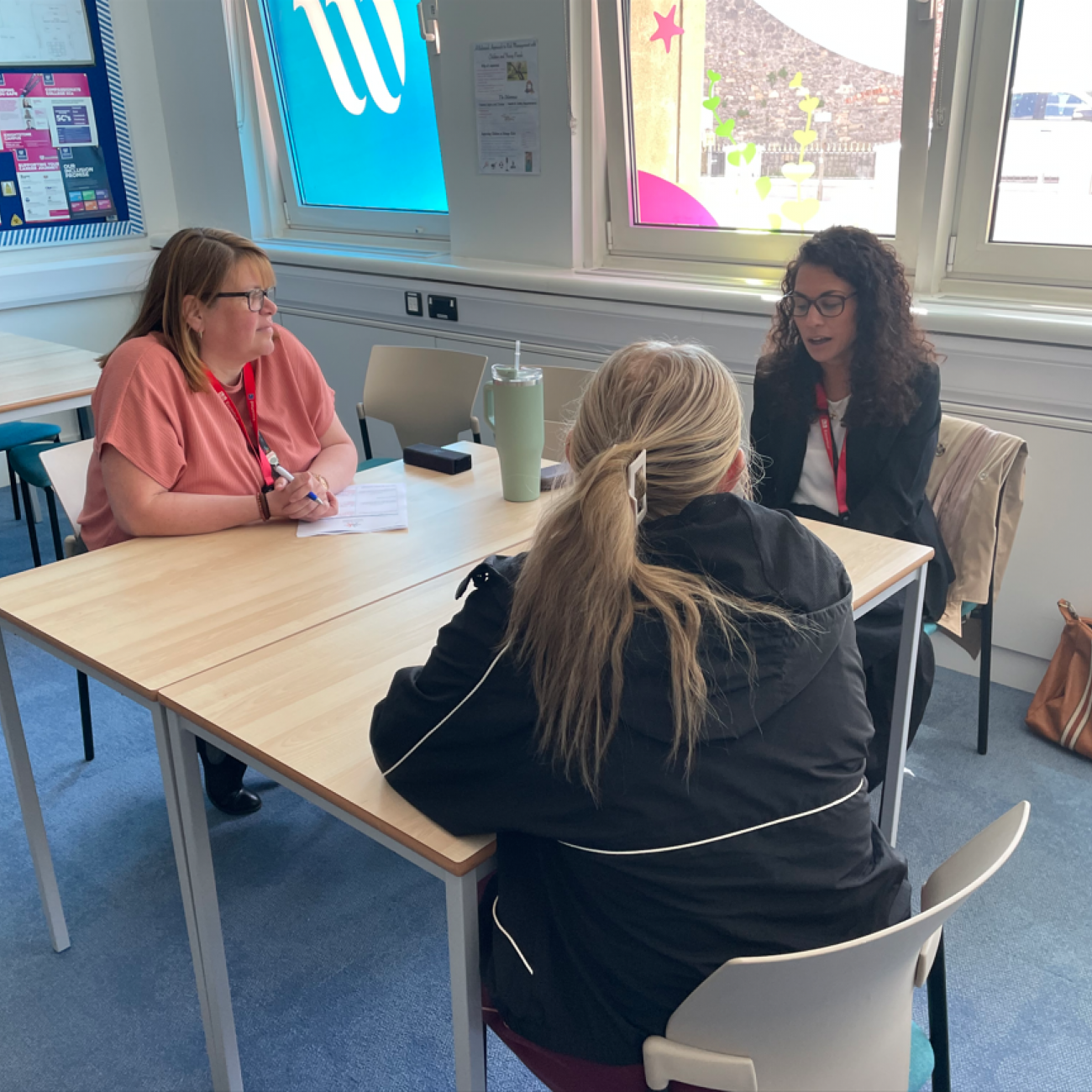 Amy and Debbie interviewing a student