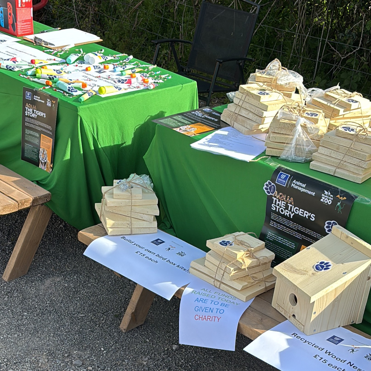students selling handmade birdhouses at craft fair
