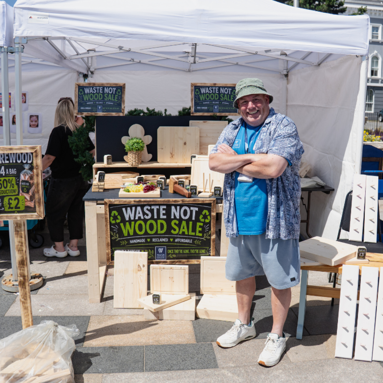 Carpentry Pop up stand in gazebo with lecturer stood in front of all the products