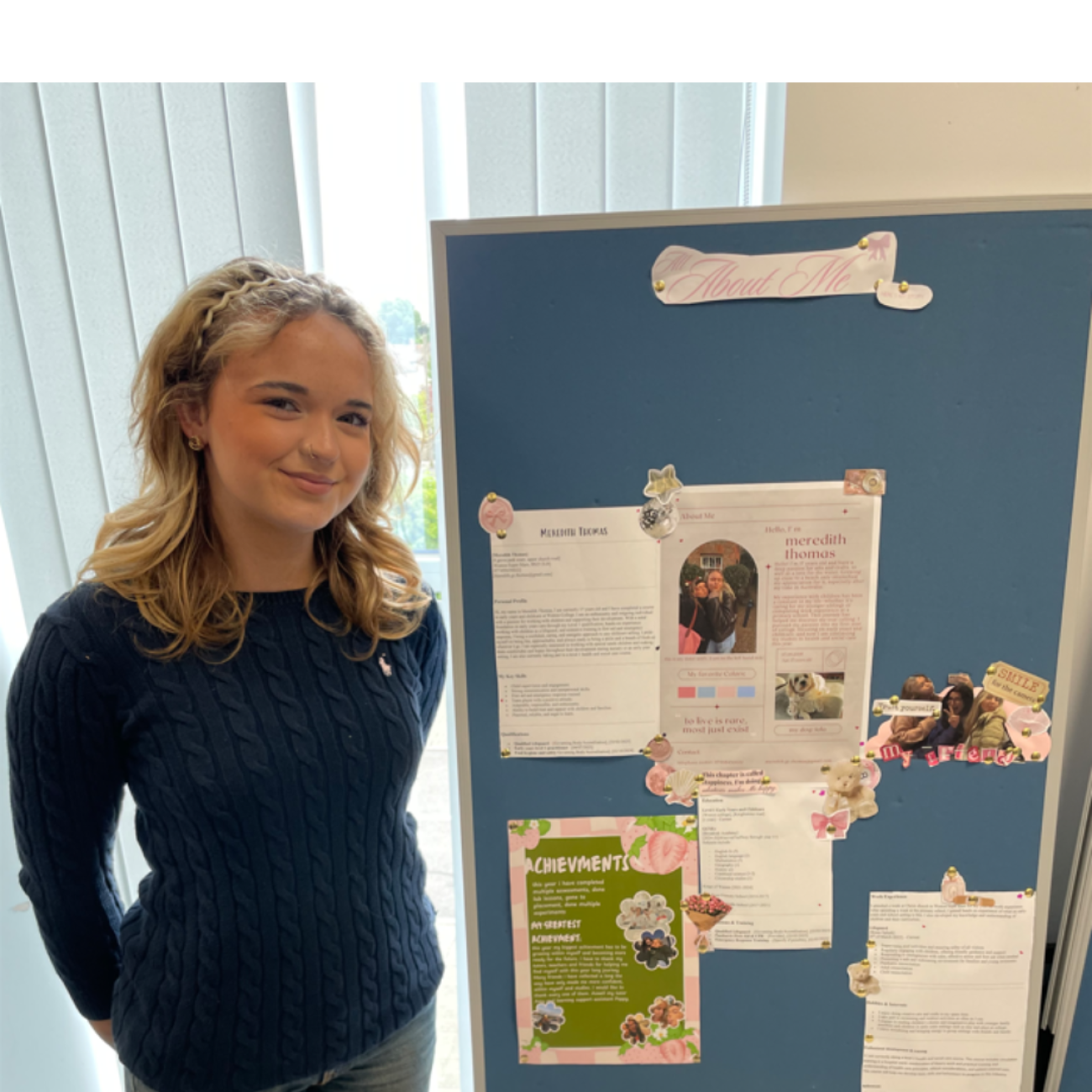Student stood with her display of work