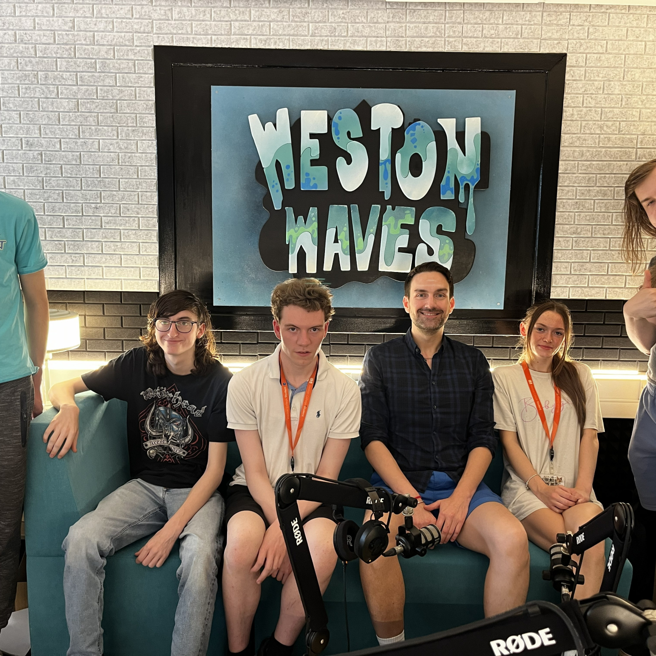 A picture of MP Dan Aldridge and five sixth form students sat in the podcast studio.  