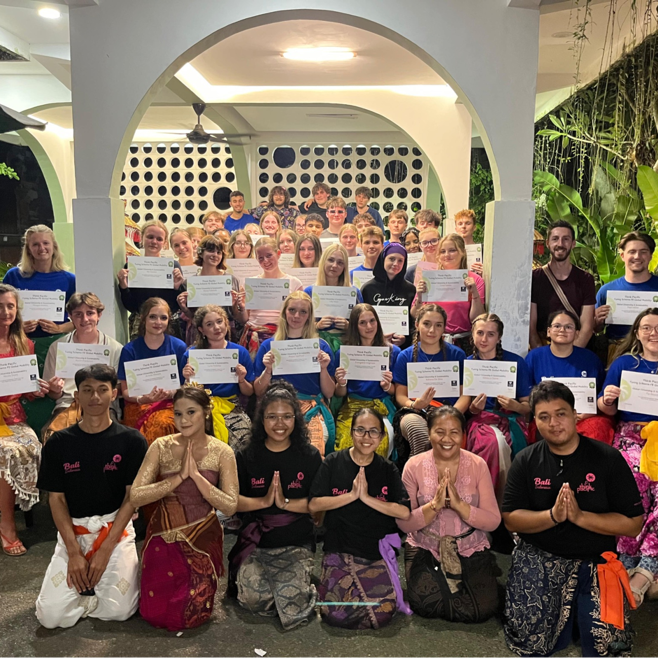 A group of students holding certificates