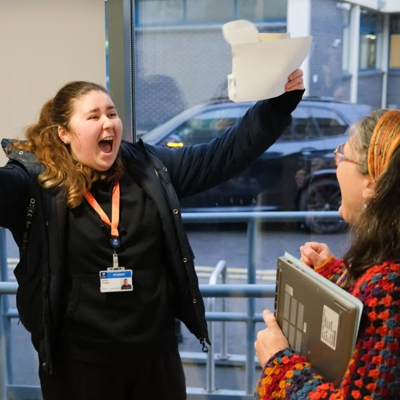 GCSE student collecting results and celebrating
