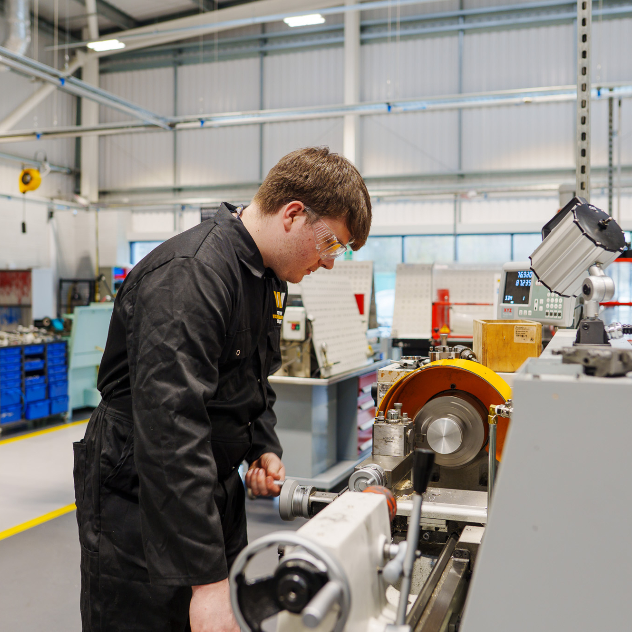 Student using manufacturing machine