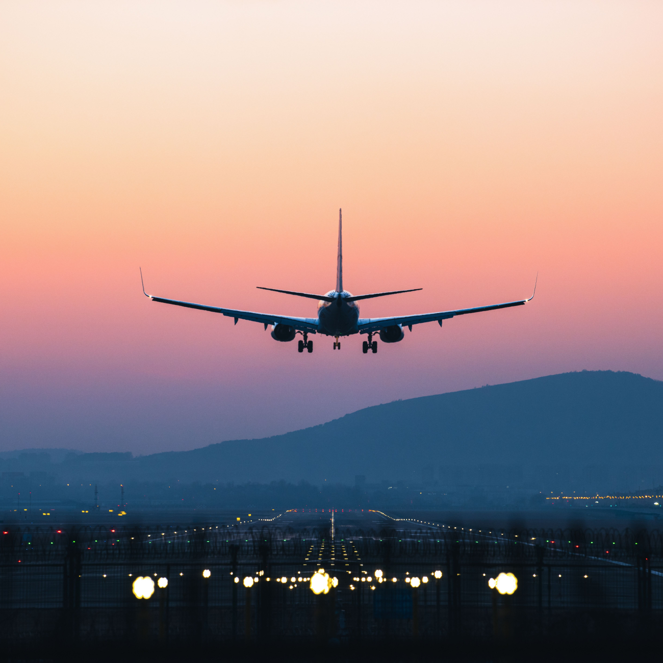 Plane taking off in the sunset