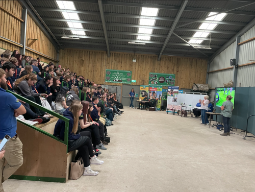 Students sat in stands listening to presentations from employers
