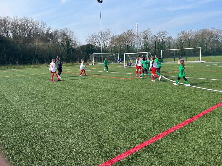 Girls playing football on weston college's 3g pitch
