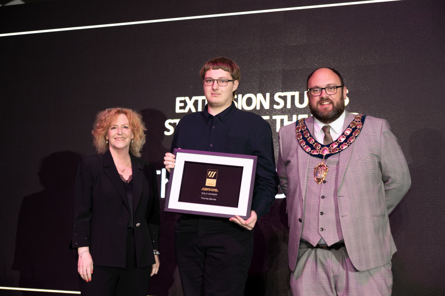 Tom collecting his award