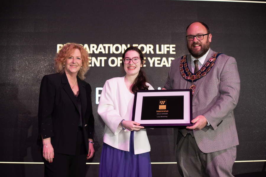 Lucy collecting her award