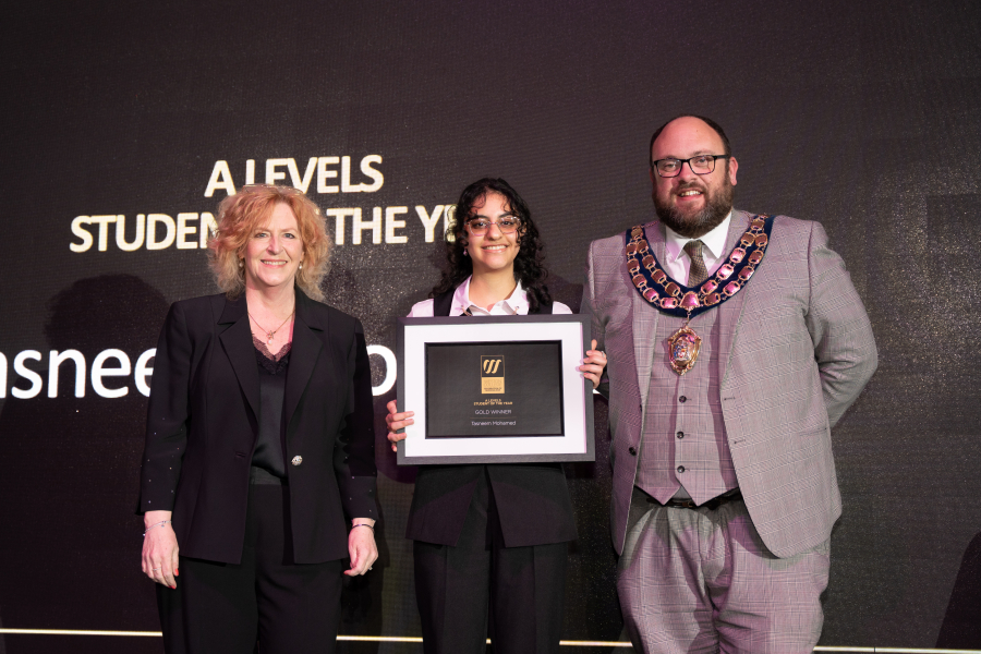 Tasneem collecting her award