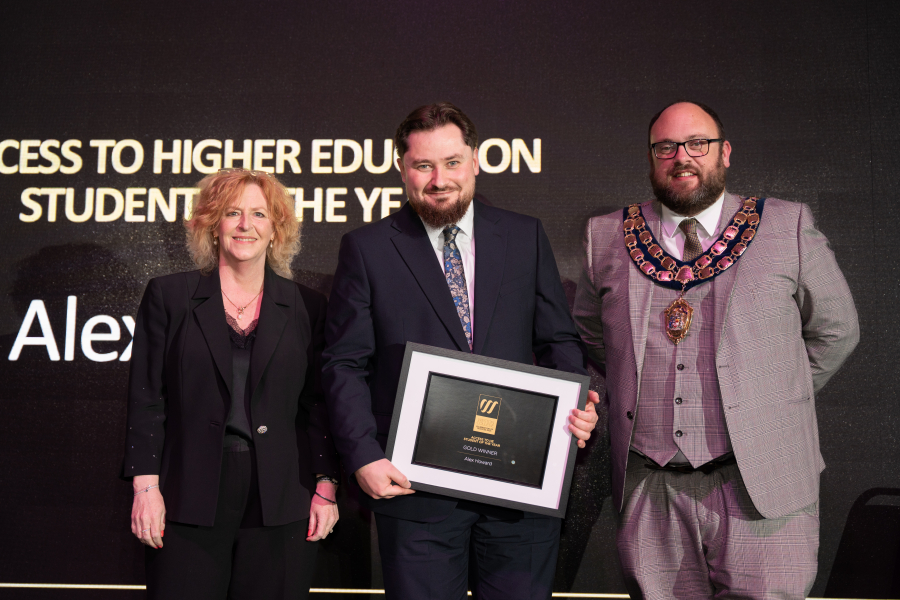 Alex Collecting his Award