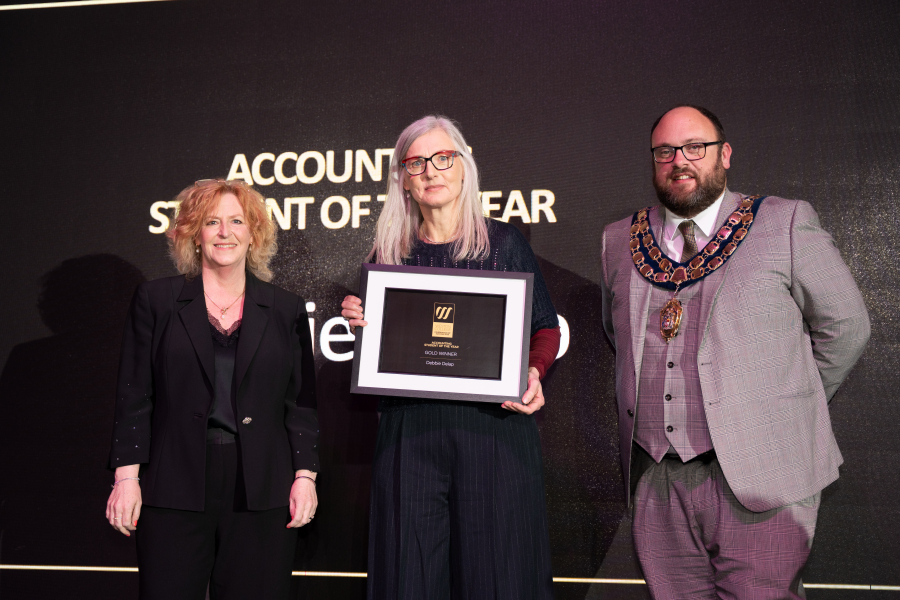 Debbie collecting her award