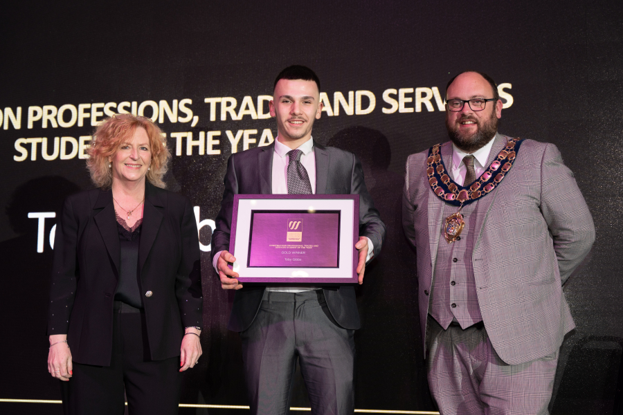 Toby collecting his award
