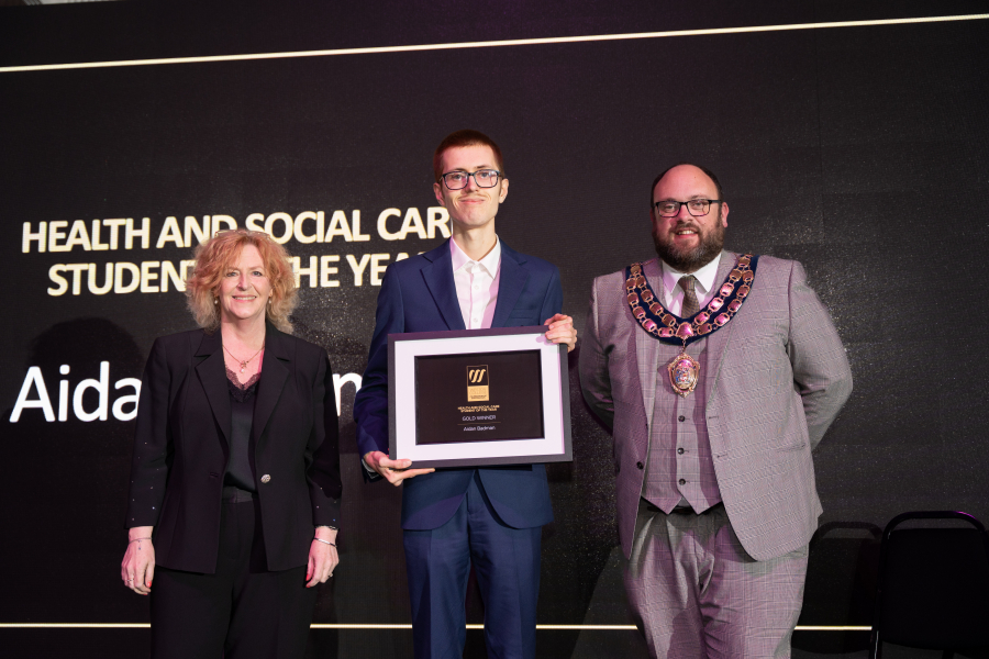 Aidan Collecting his Award