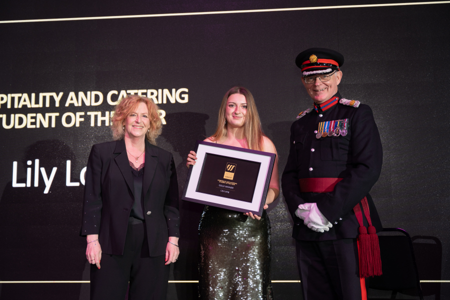 Lily collecting her award