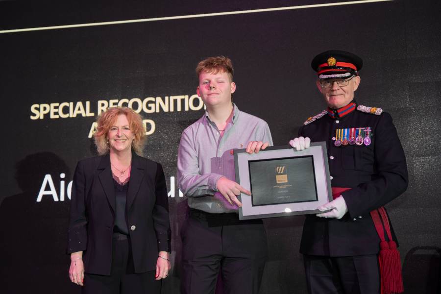 Aiden collecting his award