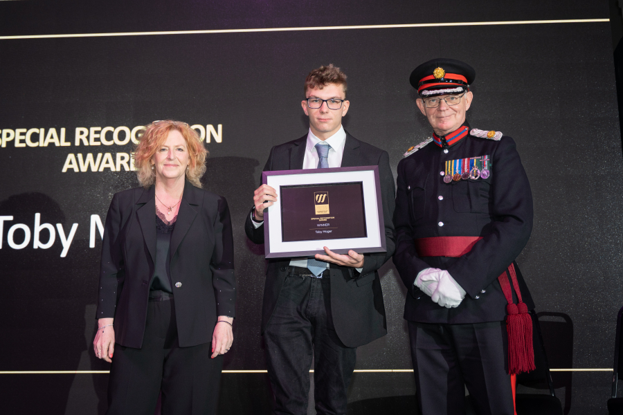 Toby collecting his award