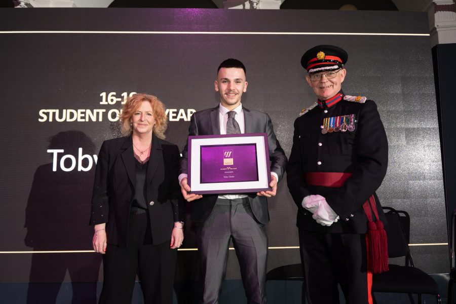 Toby collecting his award