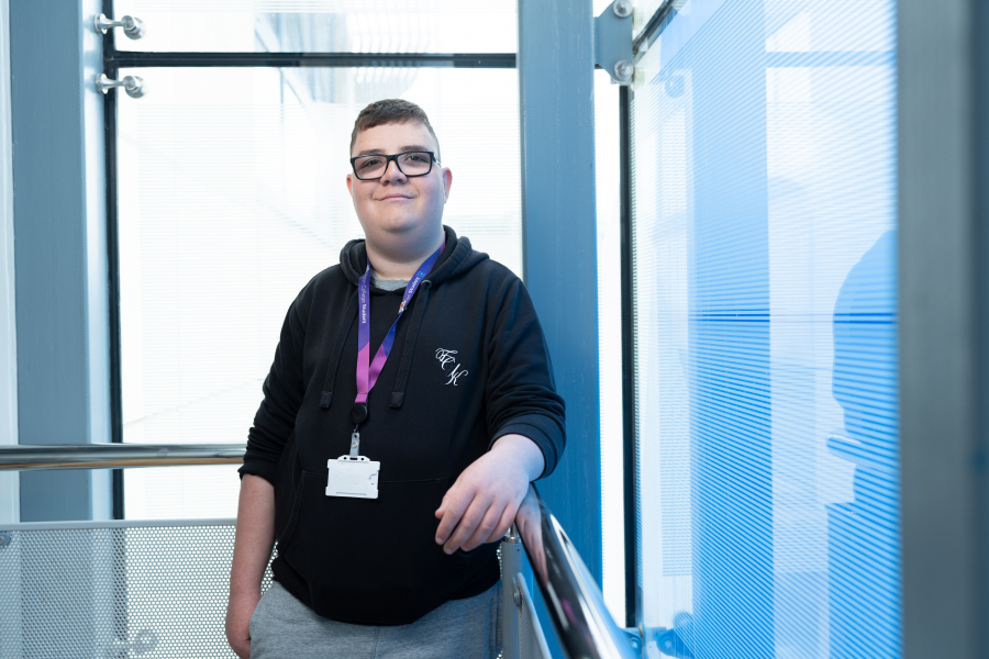 student harry smiling at the camera