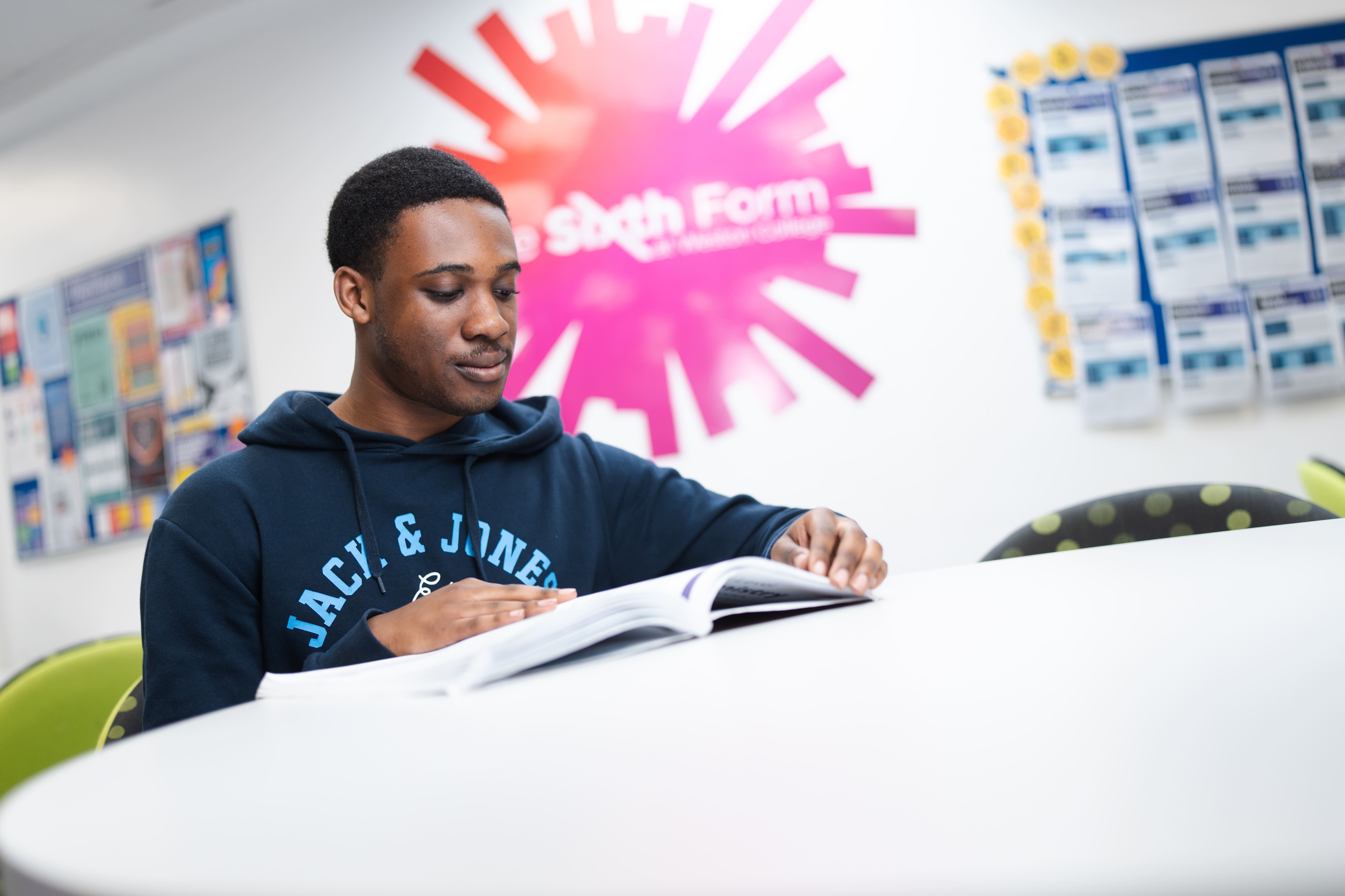Male student reading a book